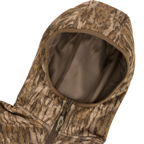 Technical Performance Fleece Full Zip Jacket with camouflage pattern, featuring a zippered chest pocket and fleece-lined hood, ideal for lightweight insulation in warmer hunting conditions.