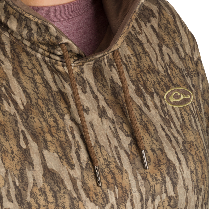 Close-up of a Women's MST Performance Hoodie, featuring a double-lined hood, kangaroo pouch, and a soft, combed fleece interior for added warmth and comfort.