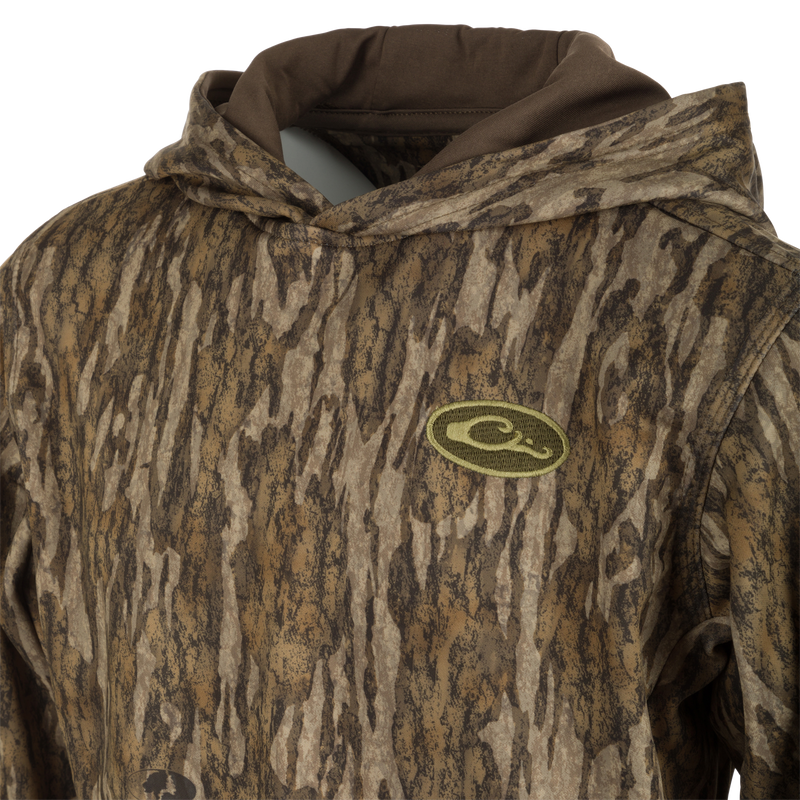 Youth MST Performance Hoodie - Realtree: A camouflage hoodie featuring a logo, double-lined drawstring hood, kangaroo pouch, and soft, combed fleece interior for warmth and comfort.