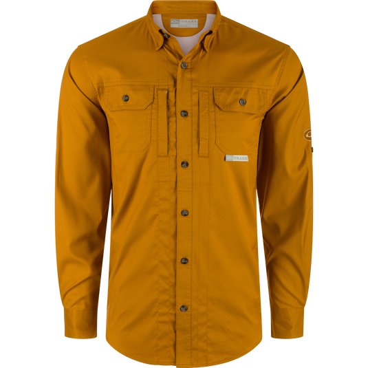 Drake Waterfowl's Wingshooters Trey Dobby Button-Down Shirt: Polyester/Spandex blend, UPF30, moisture-wicking, vented back, hidden pockets, sunglass wipe, adjustable cuffs. Classic meets technical for premium performance.