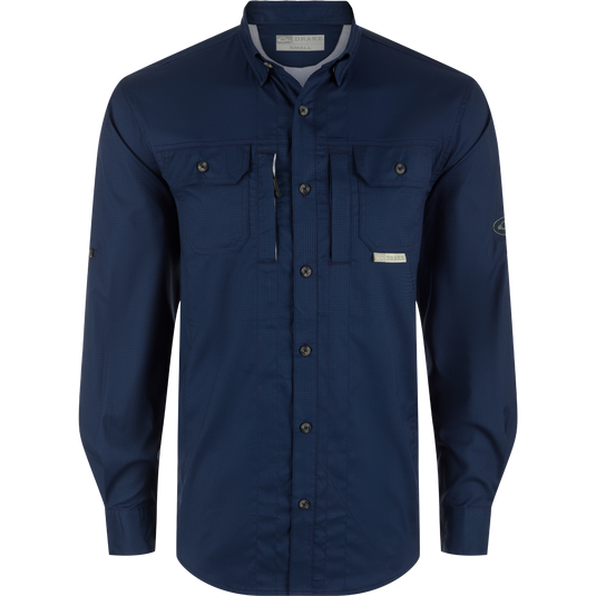 A performance-driven Wingshooters Trey Dobby Button-Down Shirt by Drake Waterfowl. Features include UPF30, moisture-wicking fabric, hidden collar, vented back, chest pockets, sunglass wipe, and adjustable cuffs.