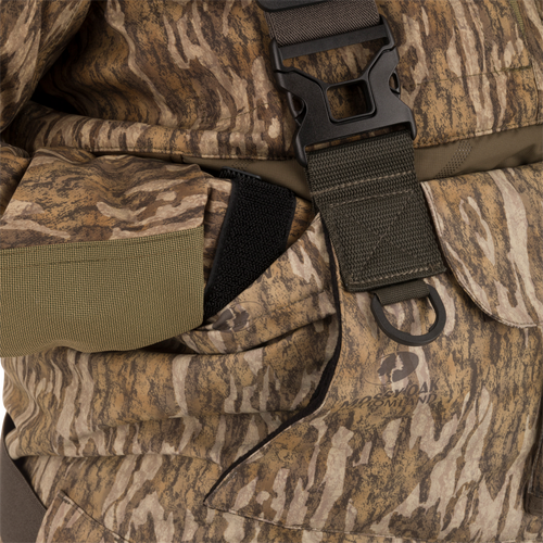Close-up of the Women’s Insulated Guardian Elite Vanguard Breathable Waders, highlighting camouflage fabric, reinforced seams, and a black strap for added durability.