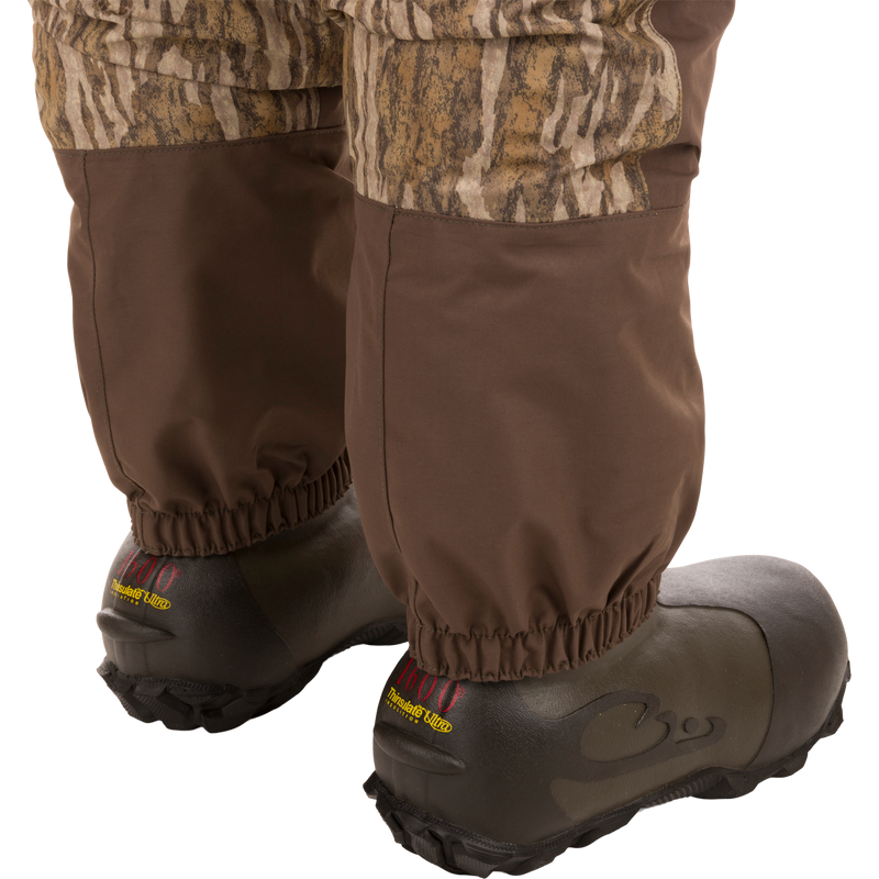 Women’s Insulated Guardian Elite Vanguard Breathable Waders featuring HD2 material, reinforced seams, internal handwarmer pockets, and 1600g Thinsulate Buckshot Mud boots for superior warmth and comfort.