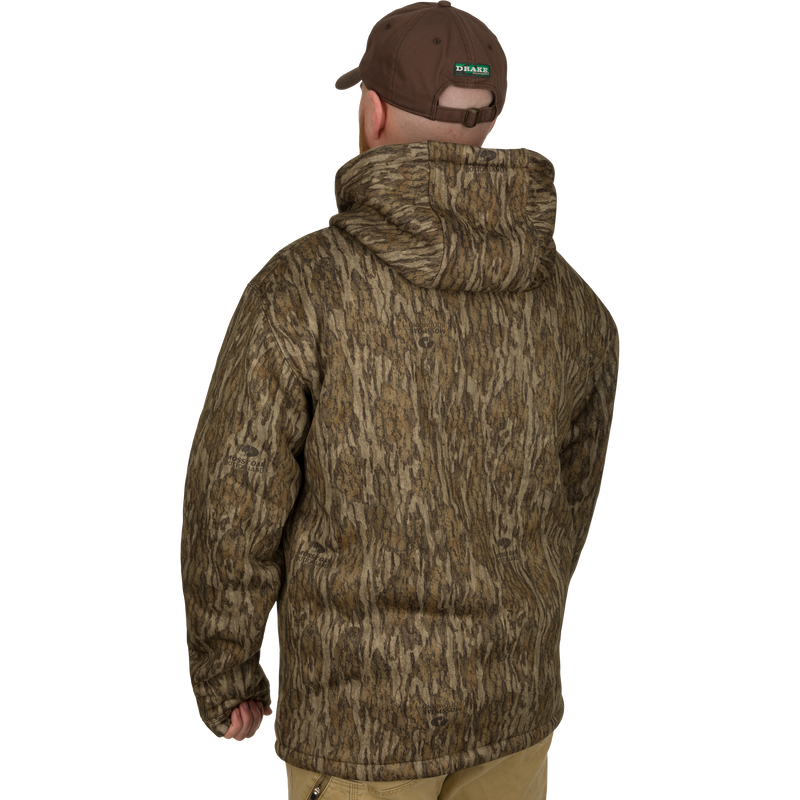 Man wearing the LST Silencer Fleece-Lined Hoodie with a double-lined hood and kangaroo pouch, suitable for everyday use and field activities.