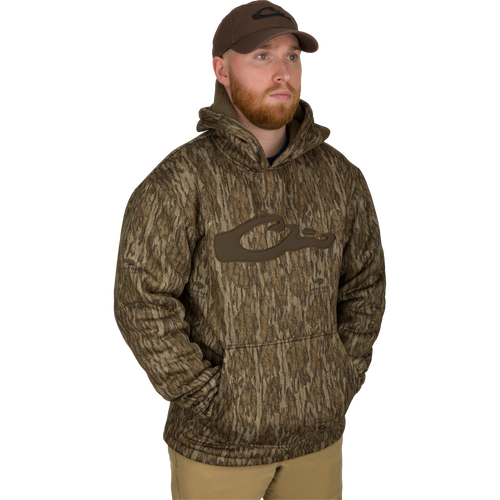 Man wearing the LST Silencer Fleece-Lined Hoodie, featuring a double-lined hood and kangaroo pouch, designed for comfort and field durability.