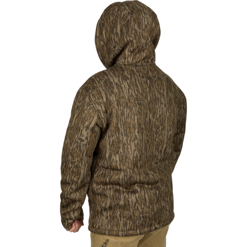 Person wearing the LST Silencer Fleece-Lined Hoodie with double-lined hood and kangaroo pouch, designed for warmth and mobility in hunting conditions.