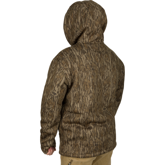 Person wearing the LST Silencer Fleece-Lined Hoodie with double-lined hood and kangaroo pouch, designed for warmth and mobility in hunting conditions.