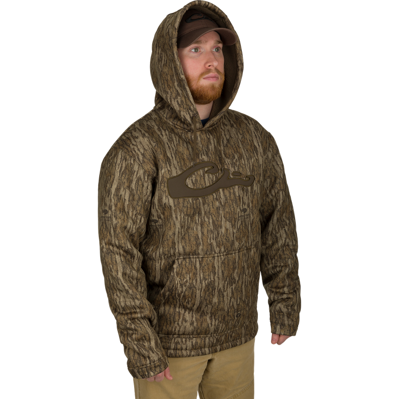 Man wearing the LST Silencer Fleece-Lined Hoodie, featuring a double-lined hood and kangaroo pouch, designed for comfort and durability in outdoor conditions.