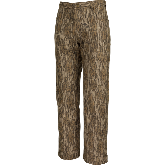 Alt text: MST Women’s Refuge Bonded Fleece Pants, camo design with tree pattern, waterproof/windproof/breathable material, fleece lining, adjustable waist, ankle cuffs, and stirrups. Ideal for hunting and outdoor activities.