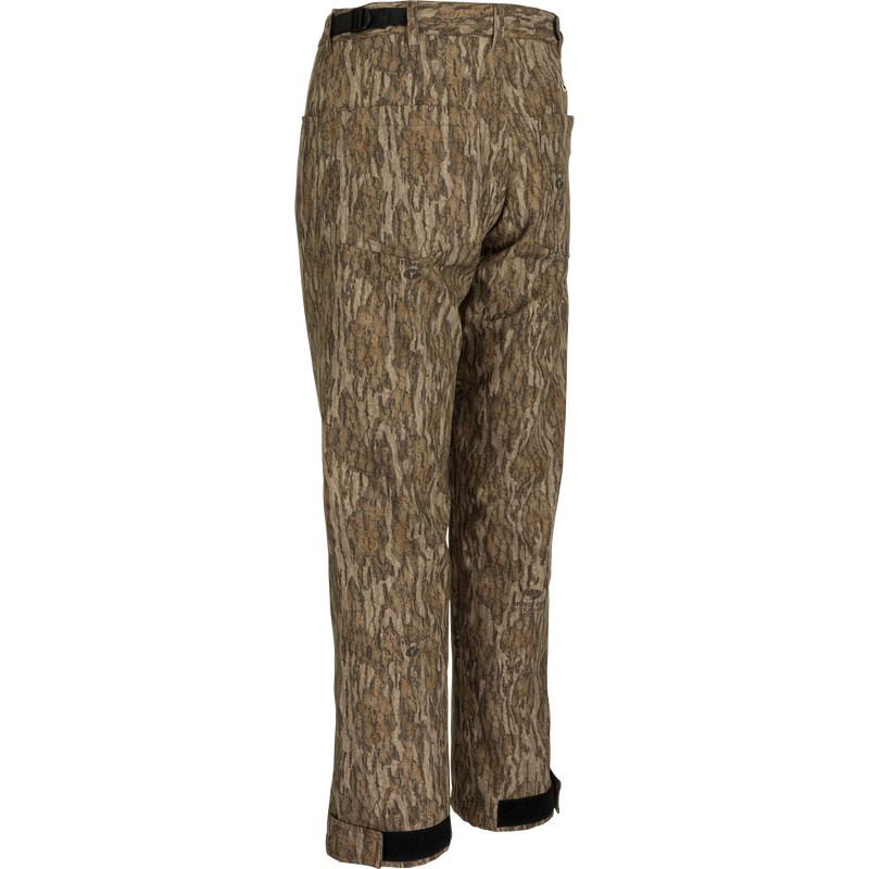 MST Women’s Refuge Bonded Fleece Pants: Camouflage pants with tree pattern. Waterproof/windproof/breathable, fleece lining, ankle garters, stirrups, adjustable cuffs. Ideal for hunting and outdoor activities.