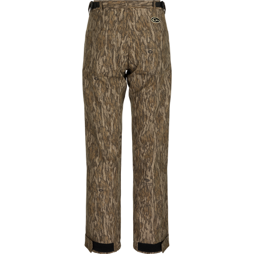 Alt text: MST Women’s Refuge Bonded Fleece Pants, camo pattern, waterproof/windproof/breathable, fleece lining, adjustable waist, ankle cuffs, stirrups, front and rear pockets.