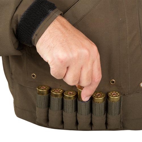 Guardian Elite Timber/Field Jacket: a hand holding a bullet in a vest