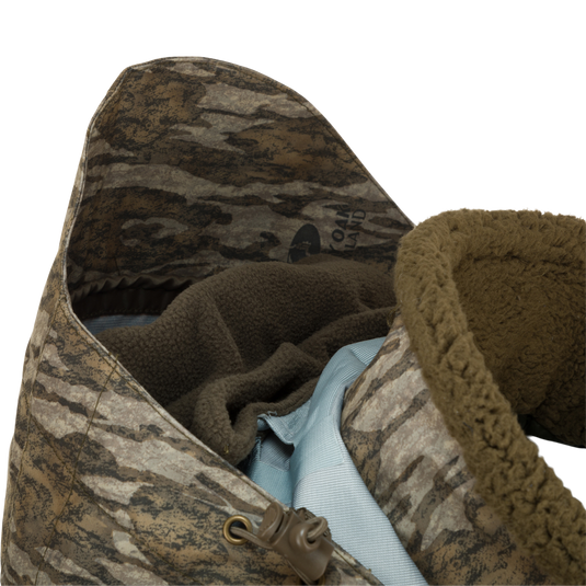 Showcasing inside hood of the LST Insulated Timber Jacket by Drake Waterfowl, designed for hunters with unique features like waterproof fabric and multiple pockets for convenience.