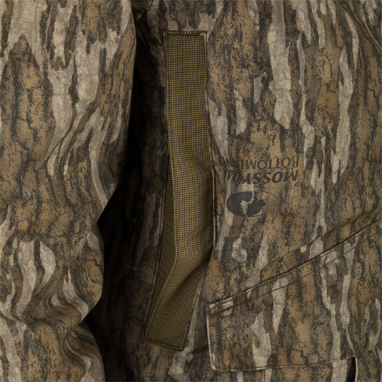 Close-up of the Guardian Elite™ LST Insulated Timber Jacket, highlighting its camouflage fabric and durable construction, ideal for hunters requiring waterproof and windproof protection.