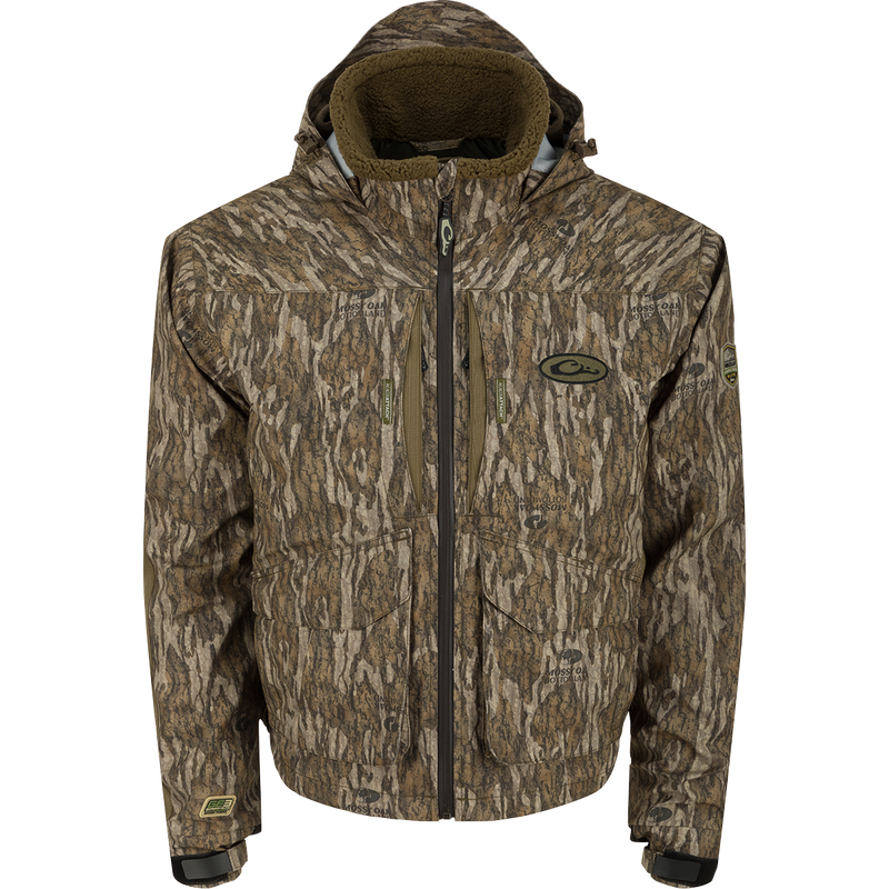 LST Insulated Timber Jacket with zippered chest pockets, sherpa-lined collar, and adjustable hood; designed for waterfowl hunters with durable, waterproof fabric and quick-access features.