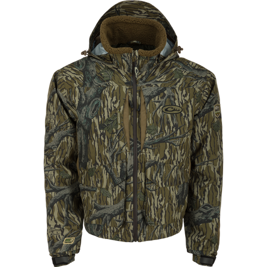 LST Insulated Timber Jacket, designed for hunters, featuring a camouflage pattern and durable construction with waterproof fabric and multiple pockets for practicality in the field.