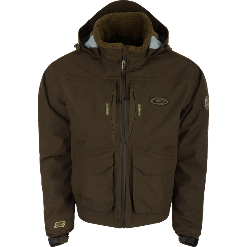 LST Insulated Timber Jacket with hood, featuring multiple pockets, zippers, and adjustable elements for hunting comfort and functionality.