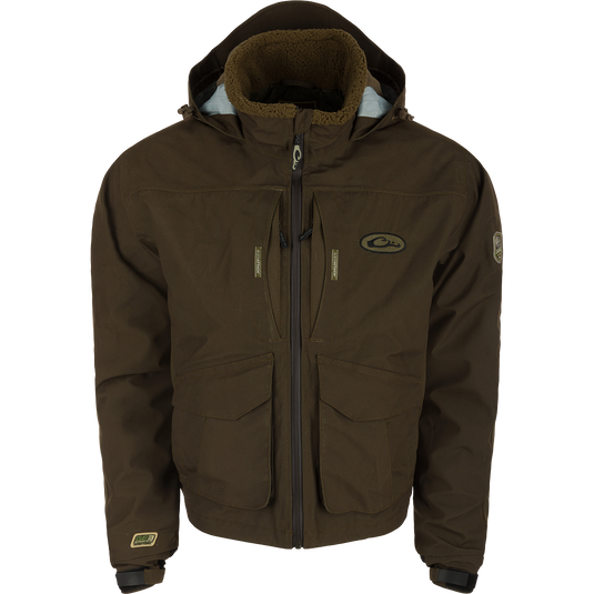 LST Insulated Timber Jacket with hood, featuring multiple pockets, zippers, and adjustable elements for hunting comfort and functionality.