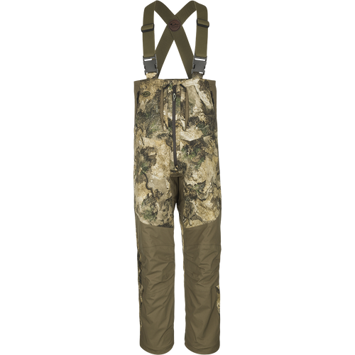 Guardian Flex™ G3 Flex™ Bib with BMZ System Liner, featuring camouflage design, adjustable suspenders, and removable insulation panels for adaptable hunting comfort.