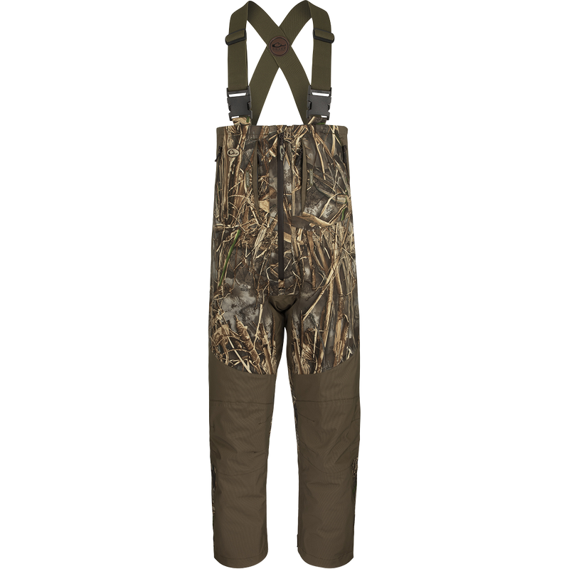 Guardian Flex G3 Flex Bib with BMZ System Liner, featuring adjustable camouflage overalls with straps, removable insulation panels, and multiple pockets for hunting adaptability.