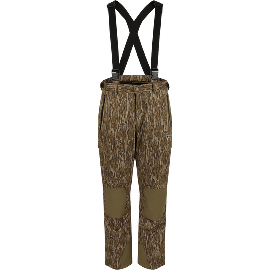 MST Waist-High Insulated Bibs with camouflage pattern and suspenders, featuring zippered pockets, adjustable Velcro waist, and heavy-duty elastic shoulder straps for secure fit.
