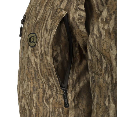 Close-up of the G3 Flex Uninsulated Waterfowlers Jacket, highlighting its rugged waterproof material, durable zippers, and multiple pockets designed for outdoor adventures.