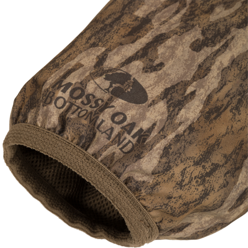 MST Quarter Zip Refuge Eqwader Jacket featuring camouflage fabric with logo, showcasing waterproof chest and breathable lower material for enhanced hunting comfort and performance.