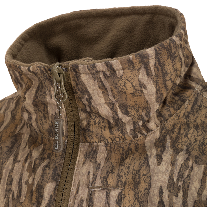 MST Quarter Zip Refuge Eqwader Jacket close-up showing waterproof fabric, zipper detail, and advanced features for enhanced performance in waterfowl hunting.