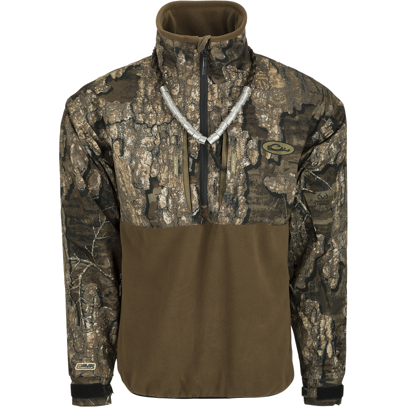 MST Guardian Eqwader Flex Fleece 1/4 Zip Jacket displayed, showing a camouflage pattern with zippered chest pockets and reinforced elbow protection, designed for outdoor and hunting use.