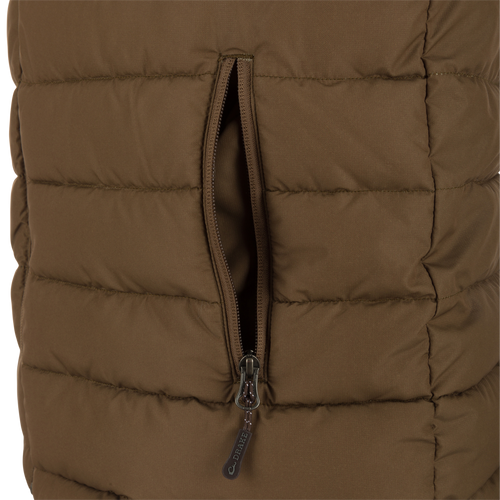 Close-up of the LST Double Down Layering Vest, highlighting the durable reverse-coil zipper and part of the microfleece-lined collar for added warmth and comfort.