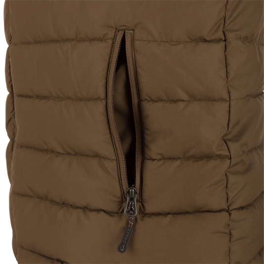 Close-up of the LST Double Down Layering Vest, highlighting the durable reverse-coil zipper and part of the microfleece-lined collar for added warmth and comfort.