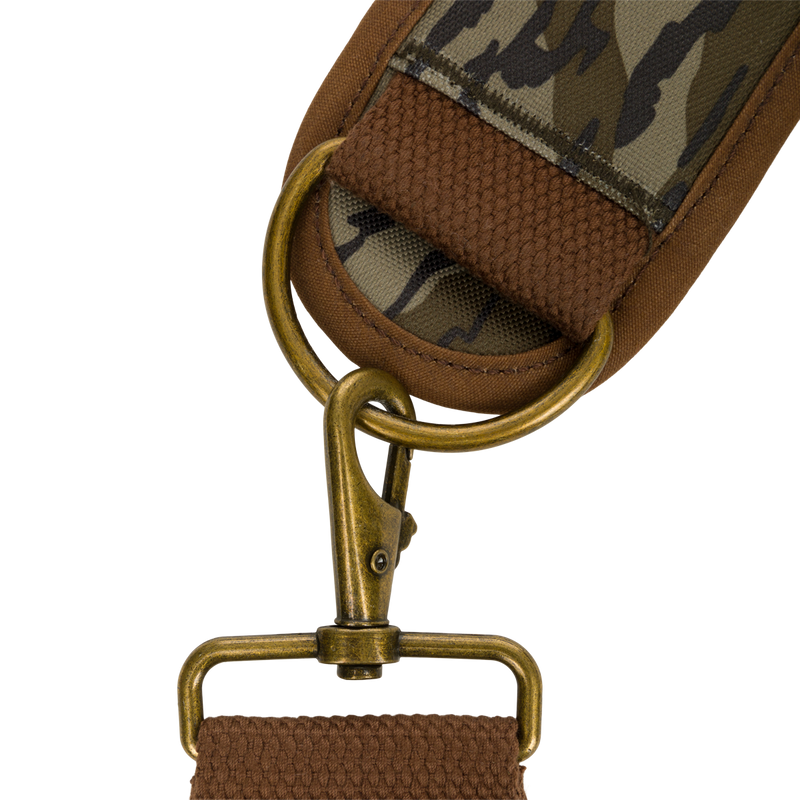 Close-up of the McAlister 3-Way Duck Tote, showcasing its durable fabric strap, metal loops, and detailed craftsmanship in polyester camo and waxed cotton canvas.