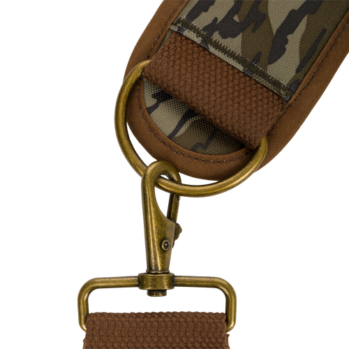 Close-up of the McAlister 3-Way Duck Tote, showcasing its durable fabric strap, metal loops, and detailed craftsmanship in polyester camo and waxed cotton canvas.