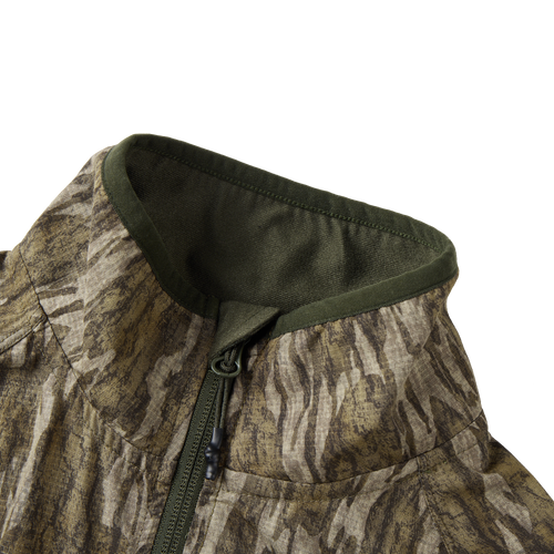 Half Zip Pullover with Spider Web Technology featuring a close-up of the jacket's zipper and breathable fabric, ideal for turkey hunting.