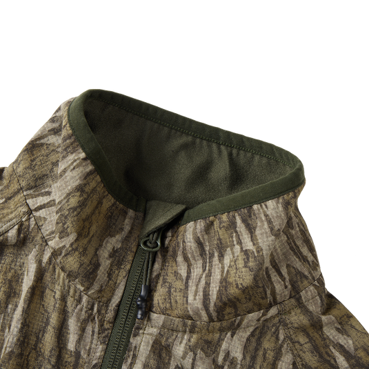 Half Zip Pullover with Spider Web Technology featuring a close-up of the jacket's zipper and breathable fabric, ideal for turkey hunting.