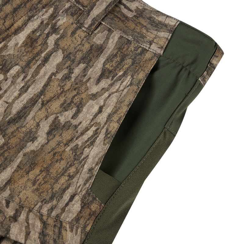 Close-up of Early Bird Turkey Pant with Insect Repellent, showcasing camouflage shorts' fabric and functional pockets designed for enhanced mobility and insect protection while hunting.