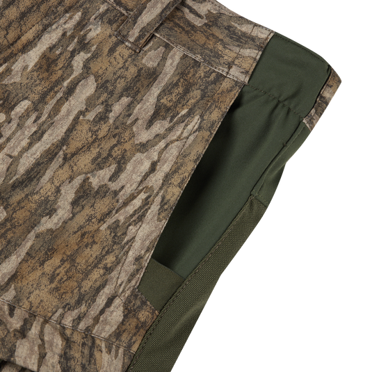 Close-up of Early Bird Turkey Pant with Insect Repellent, showcasing camouflage shorts' fabric and functional pockets designed for enhanced mobility and insect protection while hunting.