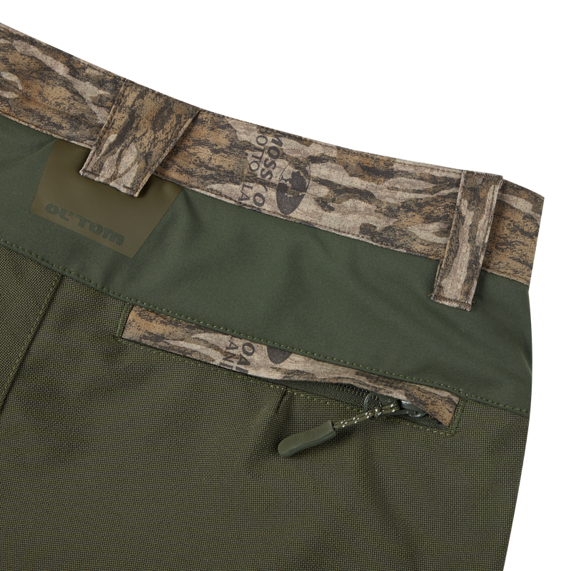 Men's Turkey Pant with Spider Web Technology, featuring camouflage fabric, zipper with loop, and stretch panels for mobility and silent hunting.