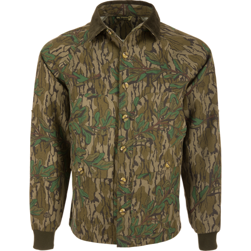 Throwback 80 Field Shirt Jacket featuring a camouflage pattern, durable cotton twill, reinforced elbows, and antique brass riveted pockets, highlighting rugged design ideal for outdoor activities.