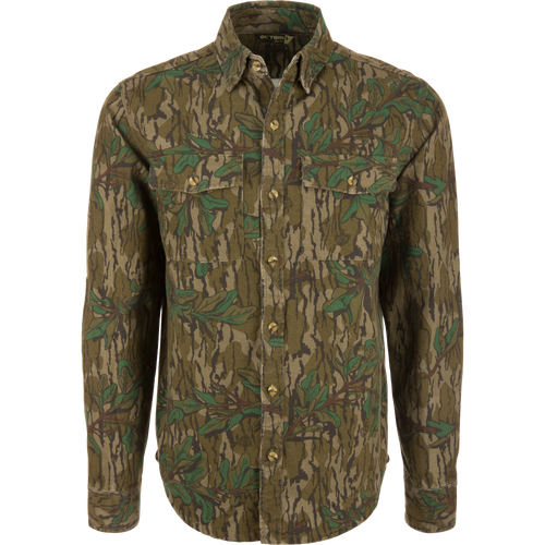 Throwback 80 Button Down Field Shirt featuring a camouflage pattern, long sleeves, durable triple-needle stitching, and reinforced elbows, made from 8.3oz 100% cotton twill.