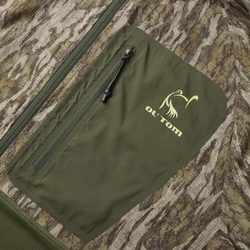 Eqwader Half Zip Pullover with Spider Web Technology, featuring a YKK zippered chest pocket and camouflage design, highlighting its durability and breathability for hunting enthusiasts.