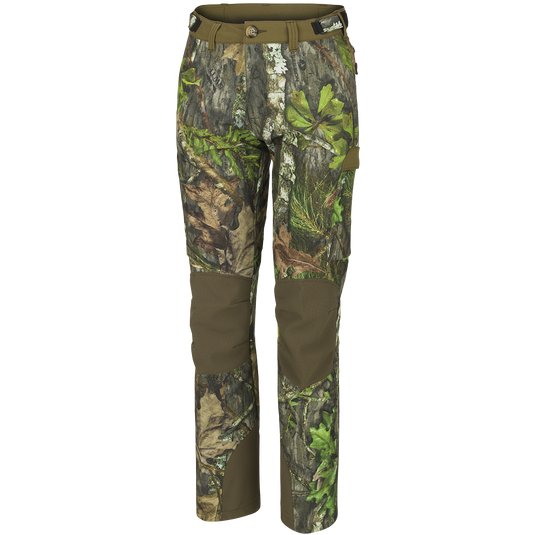 Women's Tech Stretch Turkey Pant, featuring camouflage design, 4-way stretch polyester, reinforced knees, gusseted crotch, adjustable waistband, mesh pockets, zippered back pockets, and cargo pockets.