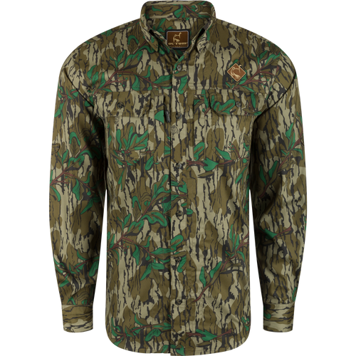 Youth Wingshooter Trey Long Sleeve Shirt featuring a camouflage pattern, logo, hidden button-down collar, vented back, and dual chest pockets, designed for performance and versatility.