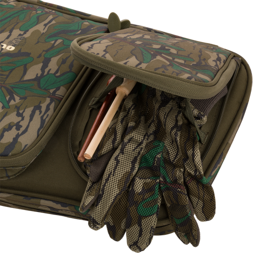 Turkey Gun with Optics Case featuring pockets for hunting essentials, a padded shoulder sling, and slots for shotgun transportation up to 52 length.