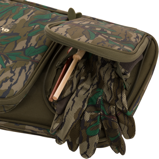 Turkey Gun with Optics Case featuring pockets for hunting essentials, a padded shoulder sling, and slots for shotgun transportation up to 52 length.