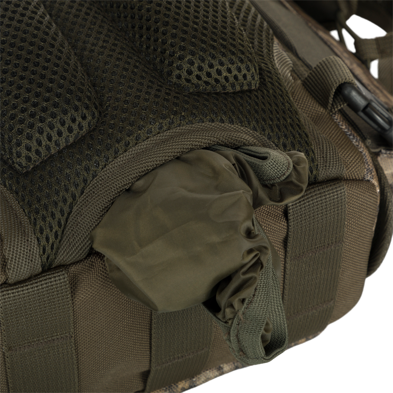 Run-N-Gun Turkey Chest Pack with multiple compartments, visible zipper, and mesh details, designed for hunting efficiency with detachable binocular harness and weather protection features.