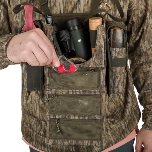 Run-N-Gun Turkey Chest Pack with camouflage vest, showcasing multiple pockets and detachable bino harness, ideal for hunting trips.