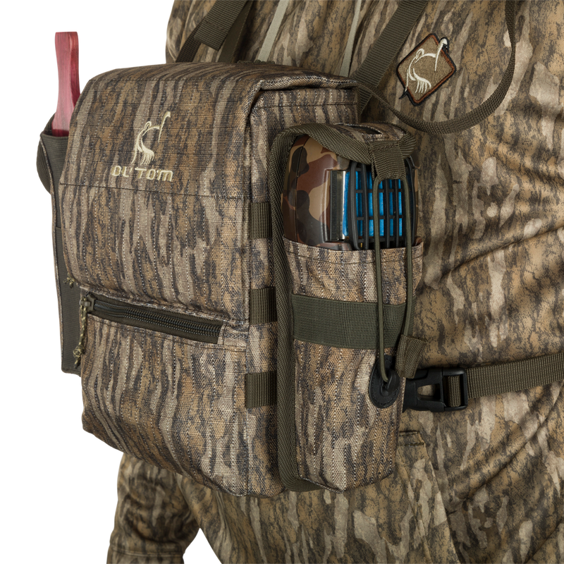 Run-N-Gun Turkey Chest Pack with camouflage design, featuring a removable bino harness, multiple pockets, and a stowable rain fly, ideal for hunting trips.