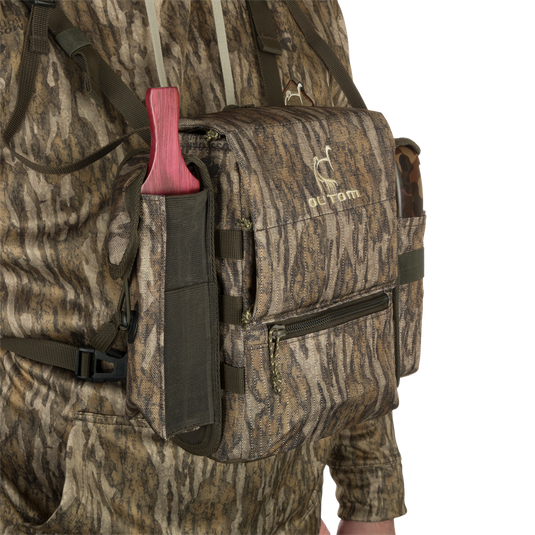 Run-N-Gun Turkey Chest Pack in camouflage, featuring multiple pockets, detachable bino harness, and a stowable rain fly, ideal for hunting trips.