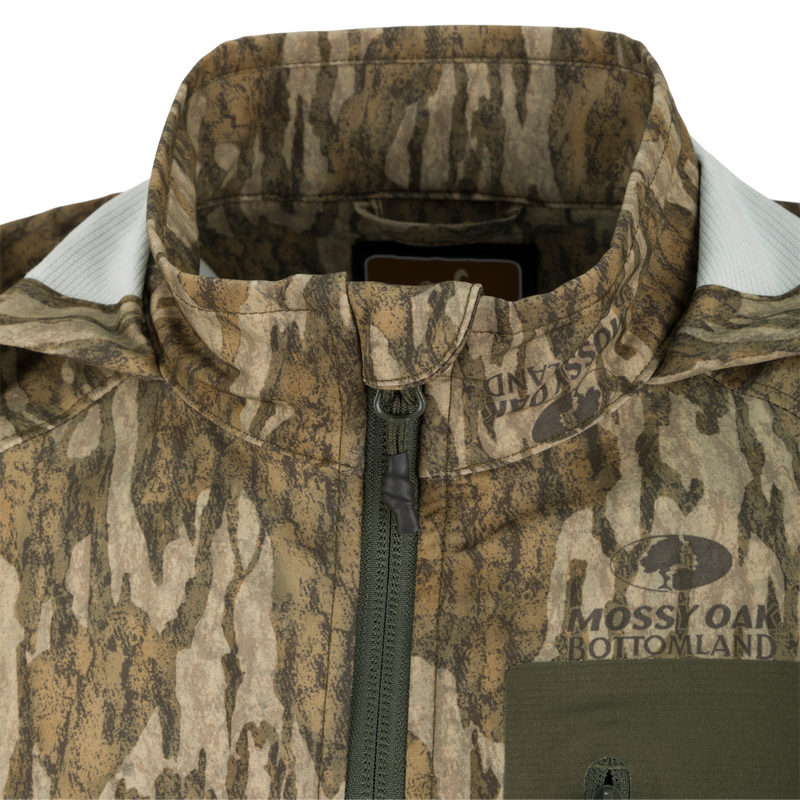 Rain Brake Lightweight Jacket close-up featuring a zipper and adjustable hood, designed for water resistance and comfort, ideal for hunting and outdoor activities.